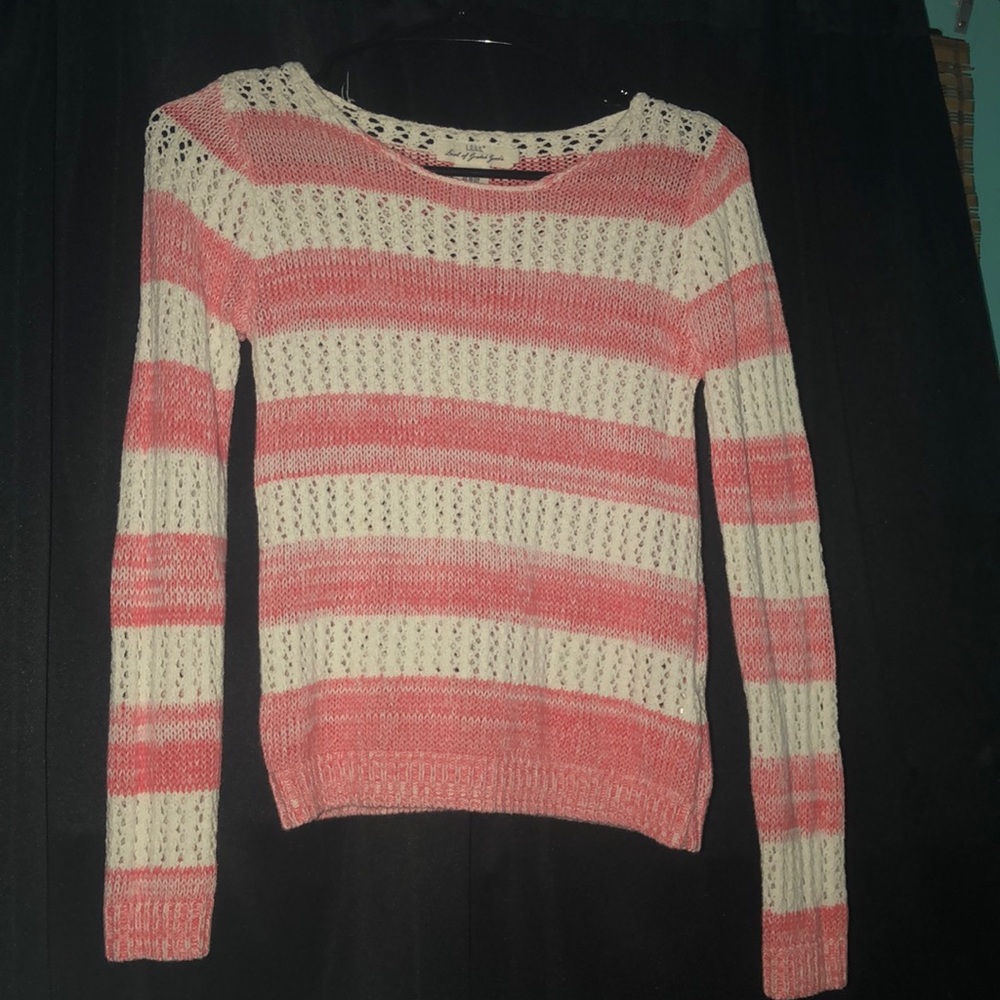 A pink/ white striped sweater
